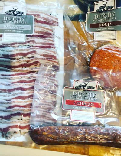 Suppliers & Producers - Packages of Duchy Charcuterie on a wooden table - Duchy Chef Cornwall